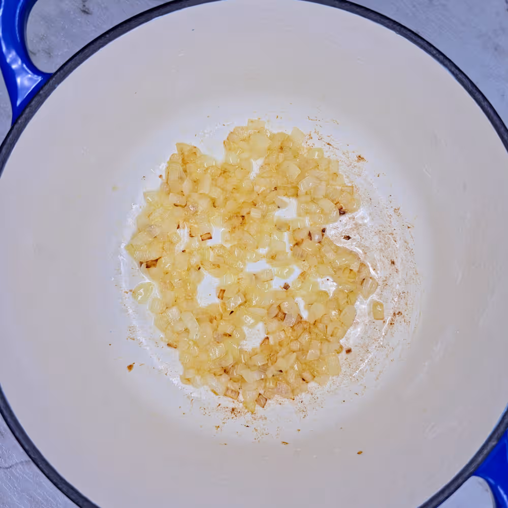  Saute the finely chopped onion in oil over medium high heat until soft and translucent. 
